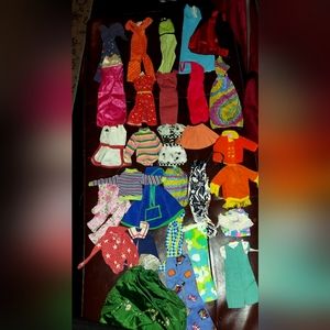 Roughly 2,000 pieces of barbie clothing read description